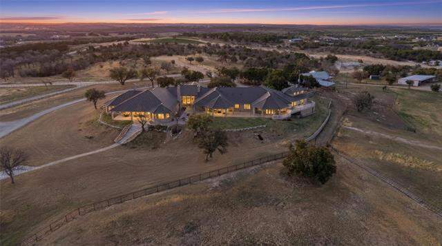 Aerial view of the residence and surrounding pastures at 128 Countdown Trail