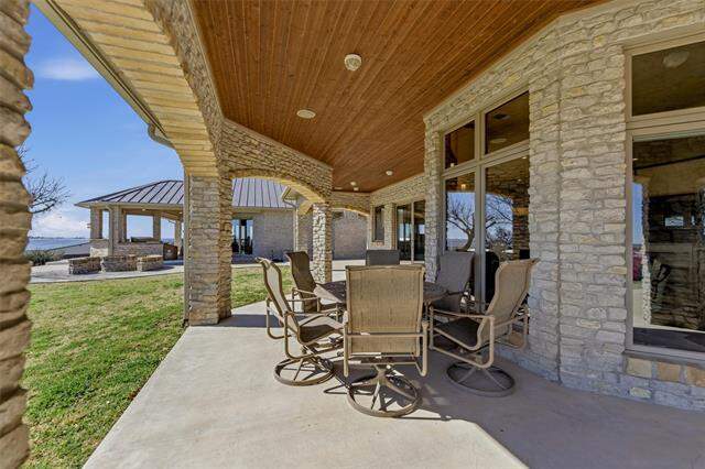 Covered stone patio at 128 Countdown Trail